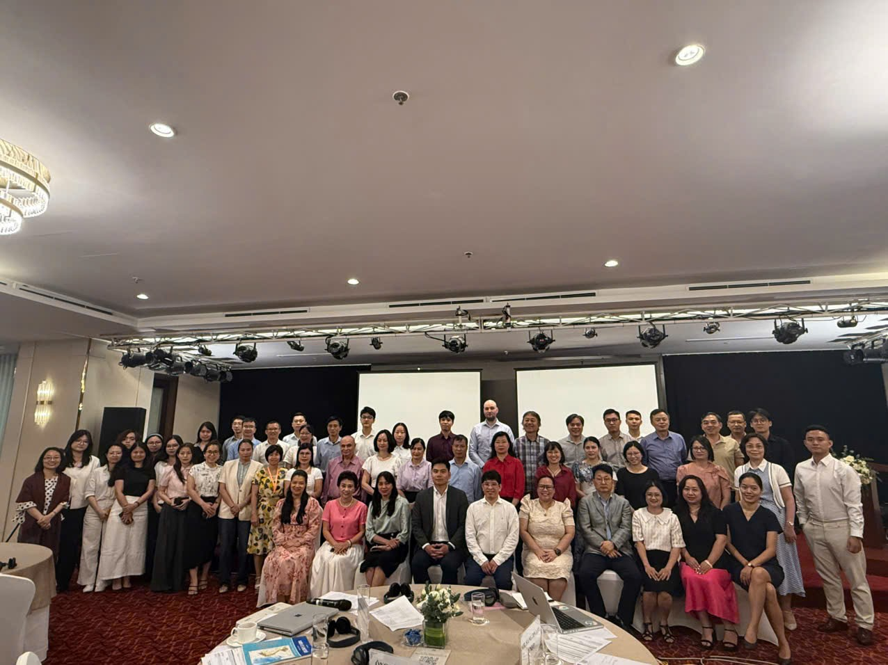 A group of people posing for a photo

Description automatically generated